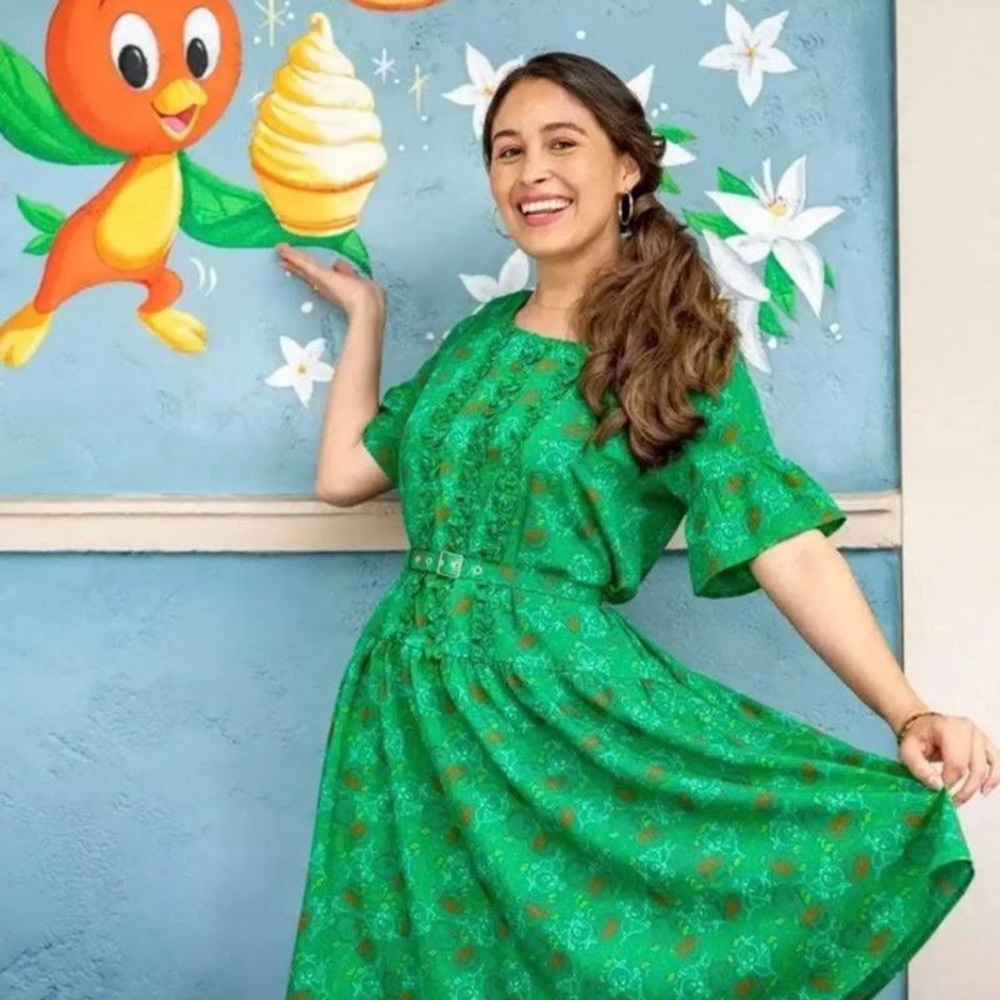 Disney’s dress shop! Green orange bird dress.